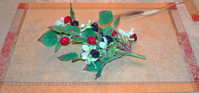 Holiday & Hearth Holiday and Hearth Lisa Novelline Lisa Anne Novelline author writer The Dance of Spring craft blog creative blog creativity decorator blog festival celebration summer seasons nature blog berries main dining table decor tablecloth dishes candles favors august fair Lammas Lughnasadh August Fair harvest-colored placemat with faux berries