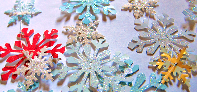 Completed Garland Up Close Holiday & Hearth Holiday and Hearth Lisa Novelline Lisa Anne Novelline author writer The Dance of Spring craft blog creative blog creativity decorator blog festival celebration seasons nature blog Winter Christmas Yule yuletide Winter Solstice December craft punch snowflakes garland glitter homemade handcrafted