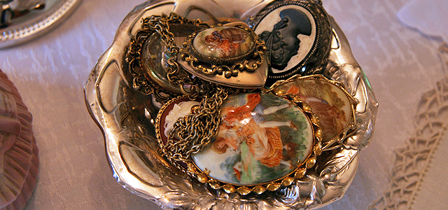 Bowl of Vintage Cameos Embellishing May Table Holiday & Hearth Holiday and Hearth Lisa Novelline Lisa Anne Novelline author writer The Dance of Spring craft blog creative blog creativity vintage roses blog festival celebration seasons nature blog spring equinox easter ostara oestre beltane may day tablescape table decor Victorian sterling silver silverplate silver plate elegant chic shabby cottage french romantic alencon lace napkin holders raised pedestal floral centerpiece dancing figures lefton candleabra crochet cameo hurdy gurdies toffees lace tumblers sugar cubes heart tea cups Victorian Trading beeswax tapers lovebird placecard holders