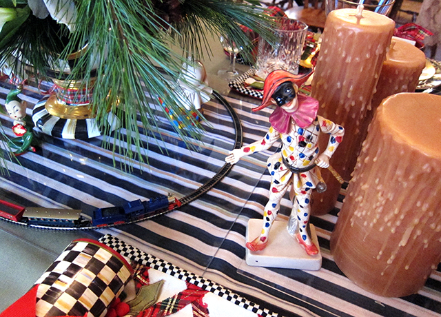 Let's Play! Whimsical Yuletide tablescape featuring MacKenzie Childs Harlequins and Operational Tabletop Model Train
